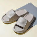 Pair of thick-soled EVA foam slippers in a choice of seven colours, showing non-slip textured sole.