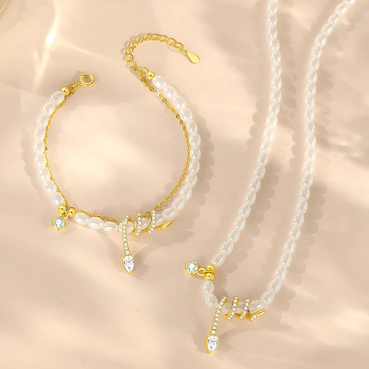 Pearl snake beaded bracelet in 925 sterling silver with electroplated gold finish and geometric animal design