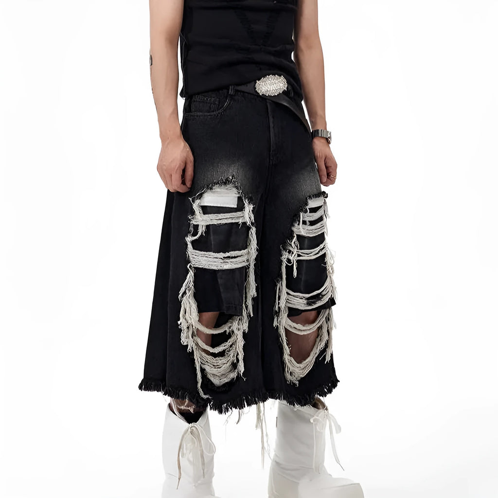 Women's black cropped wide-leg jeans with distressed patch details and mid-high waist