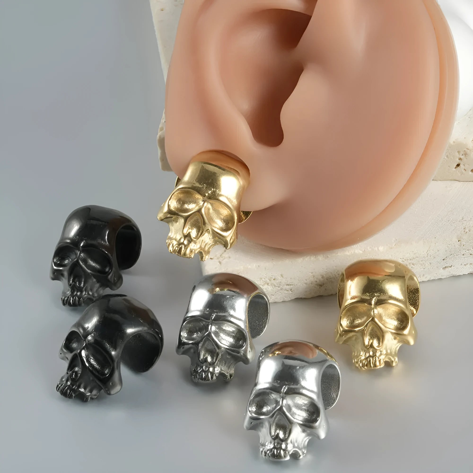 Stainless steel hollow skull Buddha earrings with geometric design in four colour options