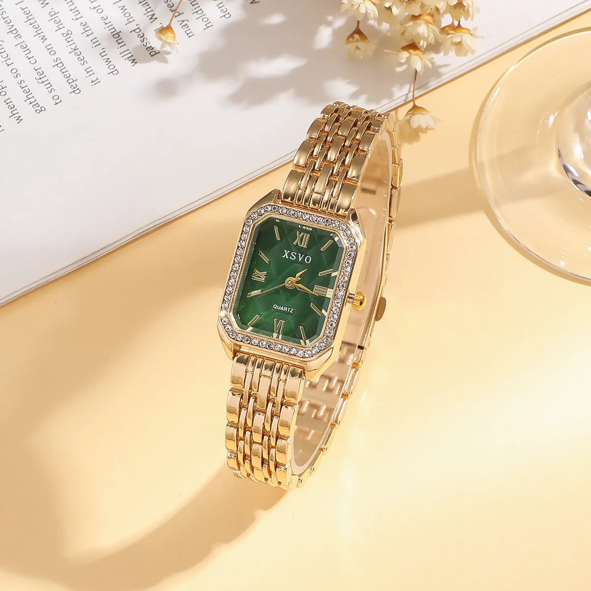 Gold green square women's watch with four matching butterfly bracelets on white background