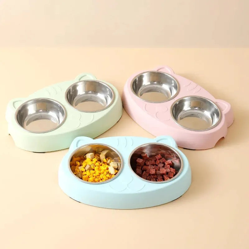 Blue Macaron double bowl plastic pet feeder for cats and dogs on a floor.