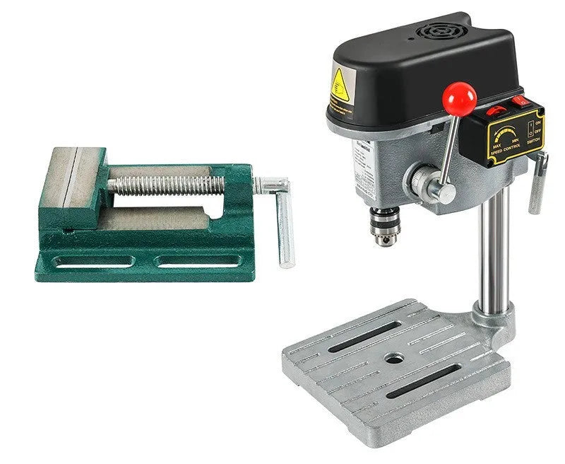 Bench drilling and milling machine with cross bench pliers and heavy duty bench pliers on a workshop table
