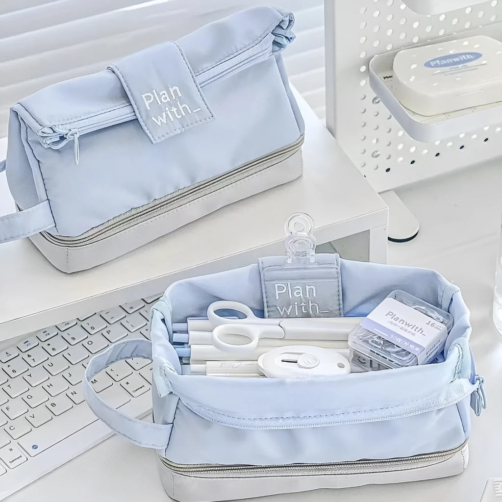 Folding double-layer student pencil case in polyester fabric, shown in dark blue, blue, and cream white colour options.
