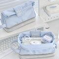 Folding double-layer student pencil case in polyester fabric, shown in dark blue, blue, and cream white colour options.