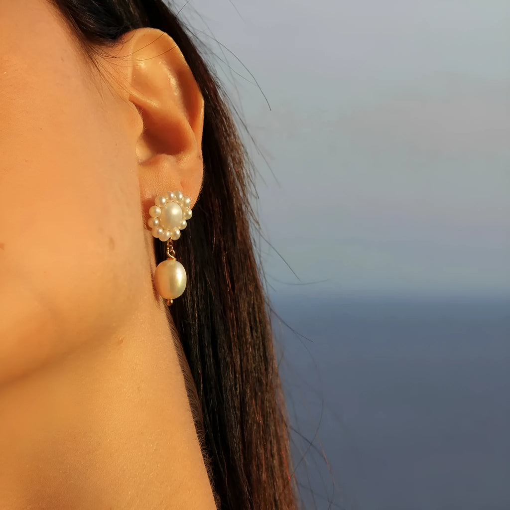 Women's stainless steel pearl ear studs with geometric ellipse shape and electroplated silver-tone finish