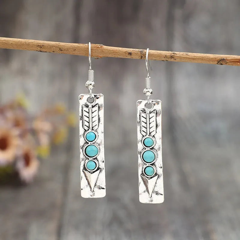 Silver geometric women's earrings with long strip design and inlaid turquoise detailing
