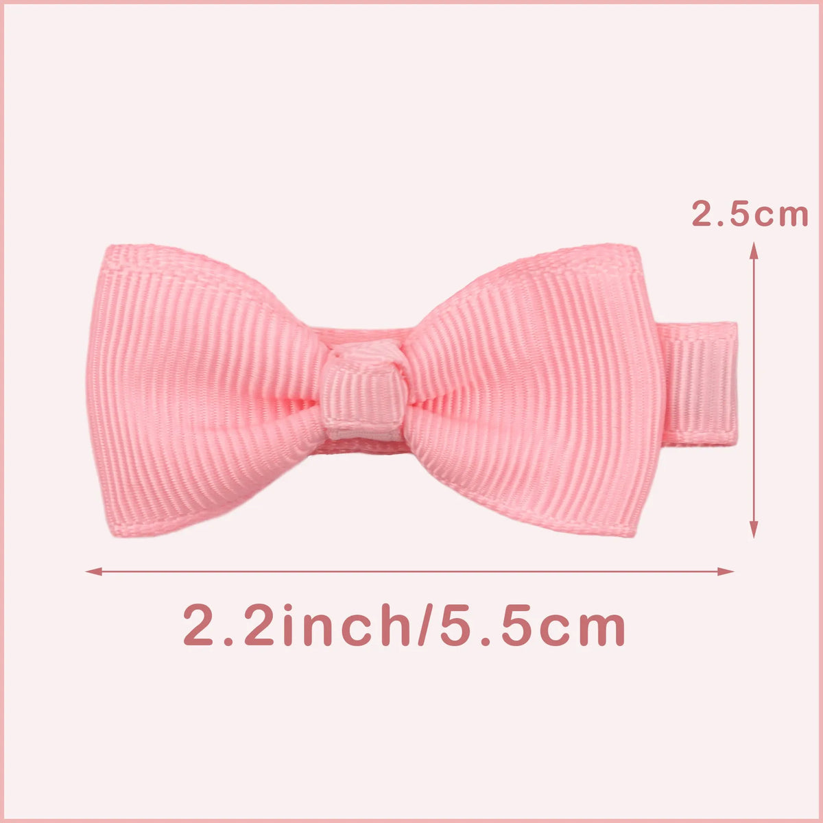 Assortment of pastel-coloured baby hair barrettes and bows laid out on a white background.