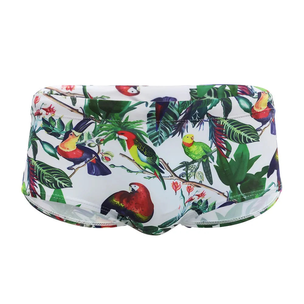 Men's swimming trunks with a colourful floral and bird print, shown in briefs and boxers styles.