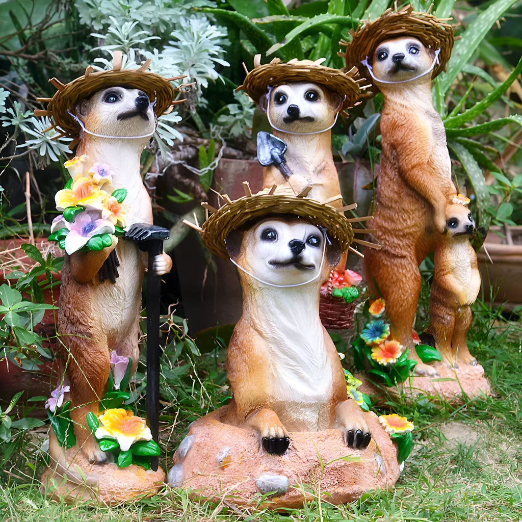 Three straw hat mongoose resin ornaments: mother and son, with rake, and with shovel figurines.