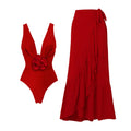 Red women's V-neck one-piece swimsuit with an open back and a separate detachable skirt.