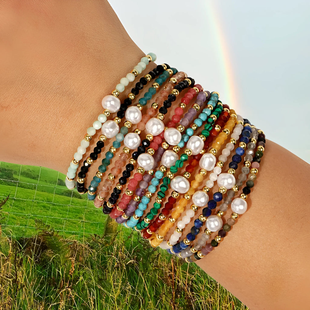 A natural stone bracelet with a geometric ellipse shape on a wrist.