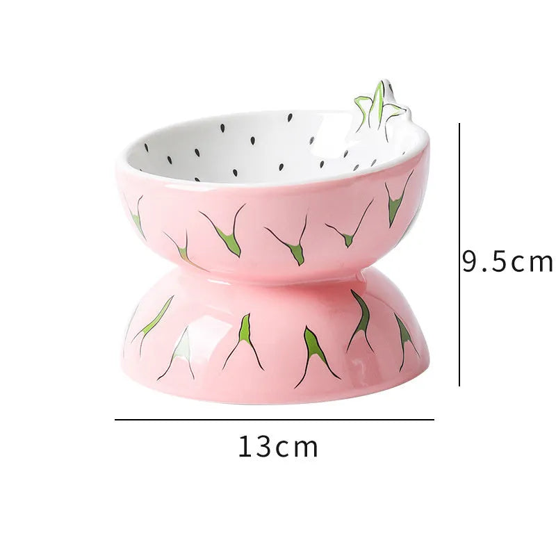 Ceramic tilted and elevated cat food bowl in orange pattern with non-slip base.
