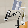 Black flexible mount holder with suction base holding tablet at adjustable angle