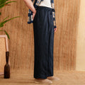 Linen straight-leg trousers with a high elasticated waistband in greige colour.
