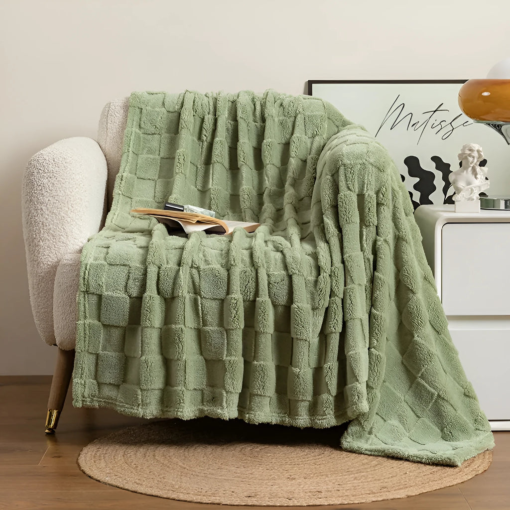 Geometric pattern polyester sofa blanket in dark grey, laid out to show size.
