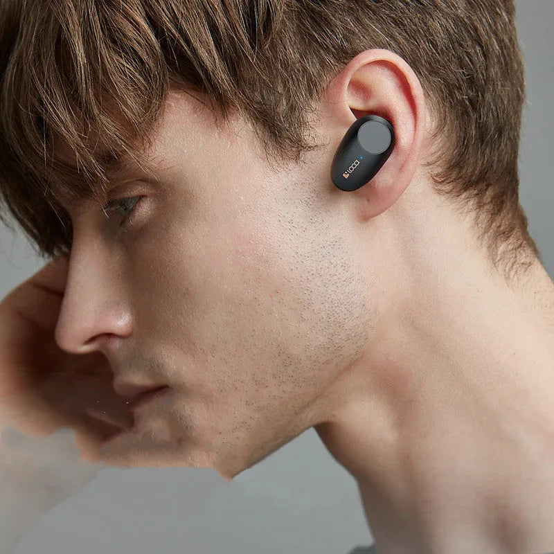 Black wireless Bluetooth headset with charging case showing ANC noise cancellation and dual charging options