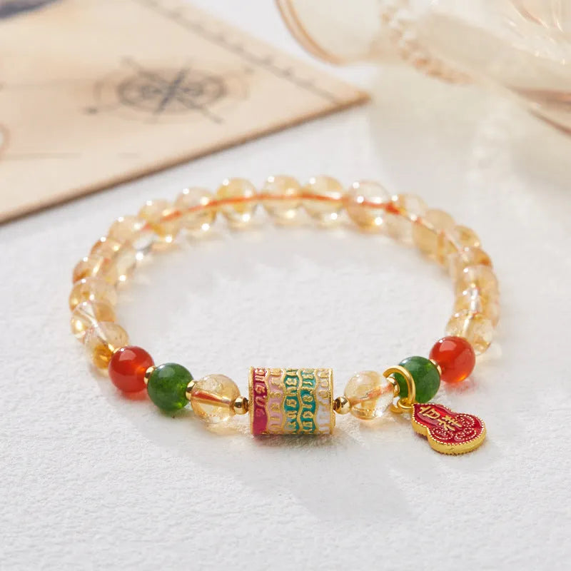 Hand-woven citrine crystal bracelet with 6mm geometric beads on a wrist