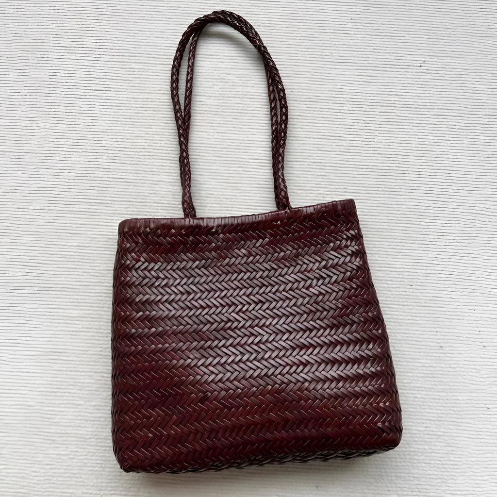 Brown handmade cowhide leather woven tote bag with three-dimensional pockets