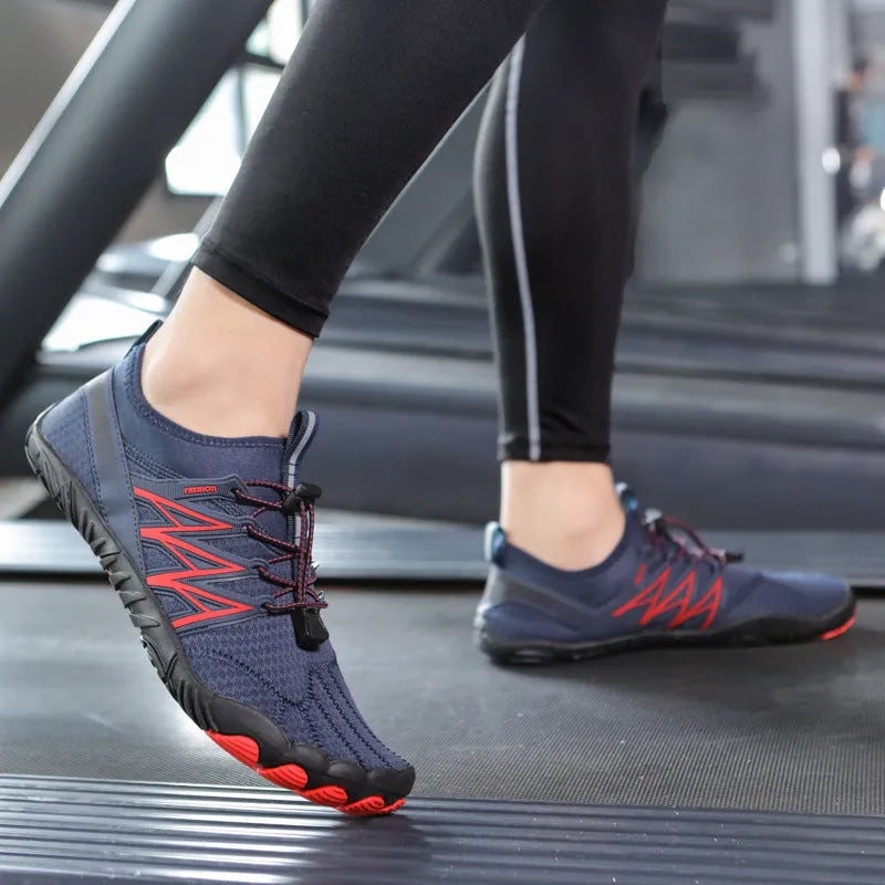 Lightweight indoor fitness training shoes with striped mesh upper and rubber sole in multiple colours.