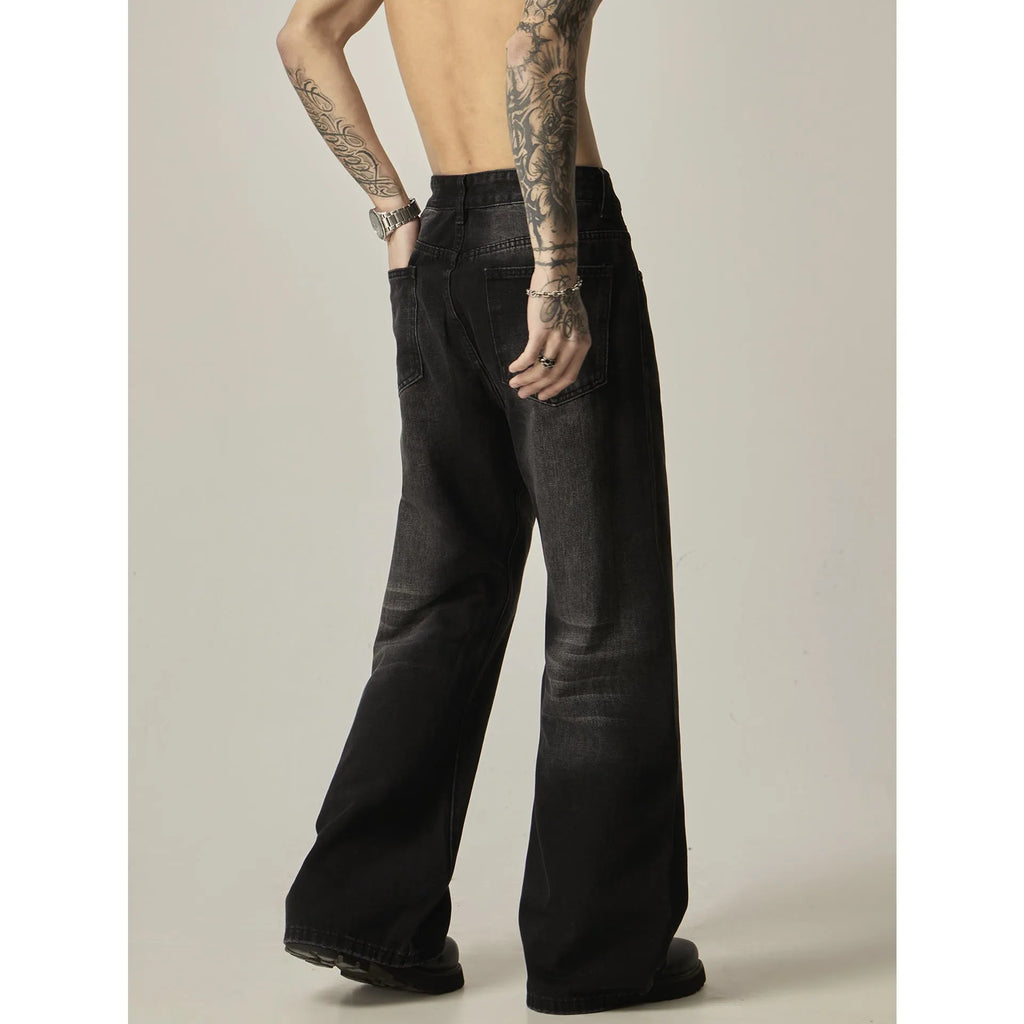 Black loose straight jeans with retro styling and zipper fly on mannequin