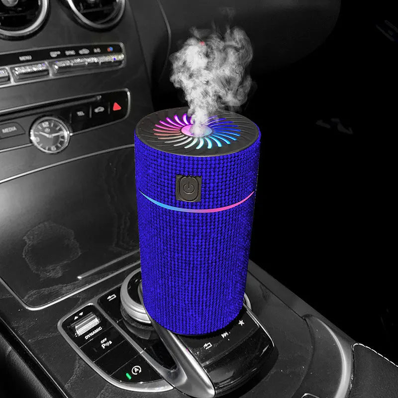 Compact car-mounted air purification humidifier unit on vehicle dashboard with USB power cord