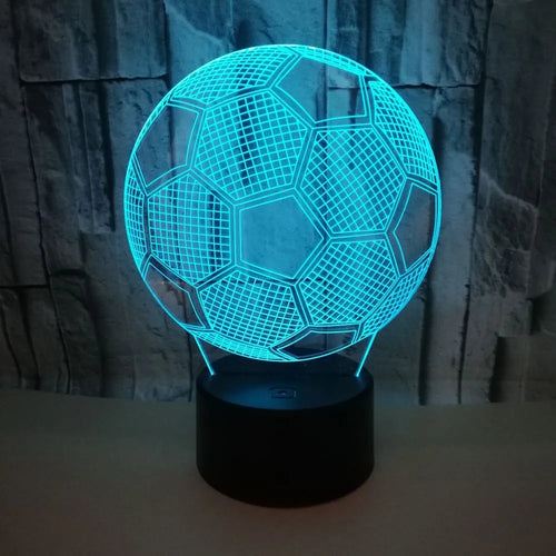 3D football shaped LED night light showing multiple colour options on a dark surface.
