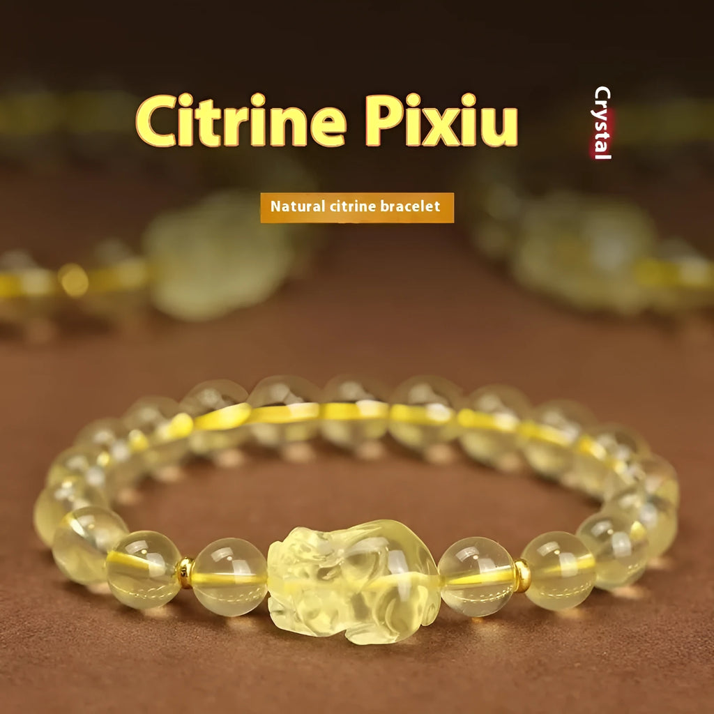 Yellow leather adjustable bracelet with a carved artificial crystal Pi Xiu charm.