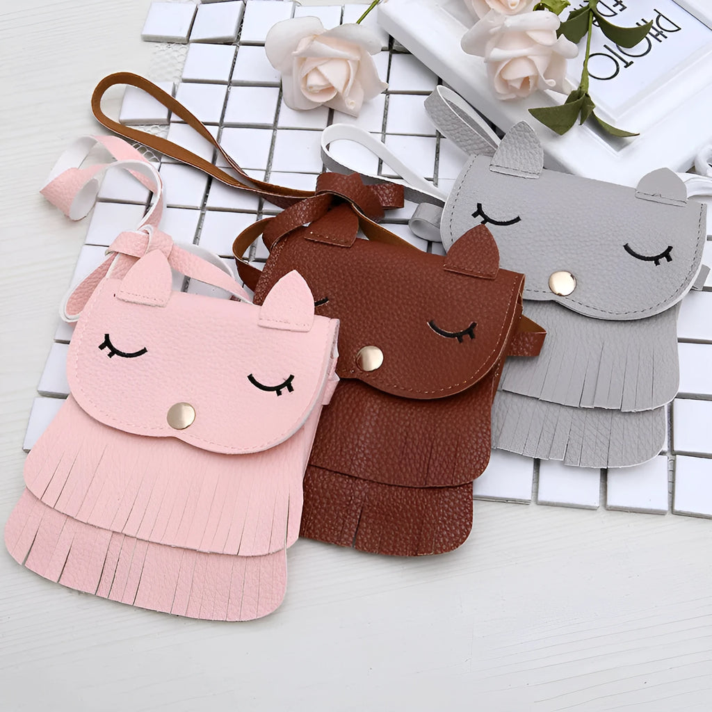 Small girls crossbody bag in PU with fox and tassel design, shown in black, brown, grey, pink, and orange