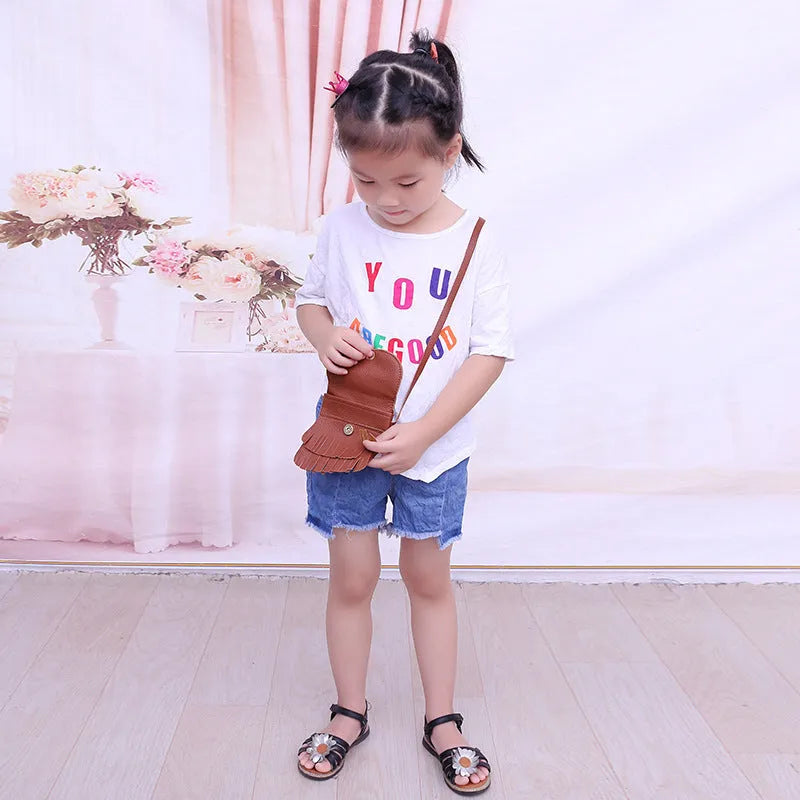 Small girls crossbody bag in PU with fox and tassel design, shown in black, brown, grey, pink, and orange