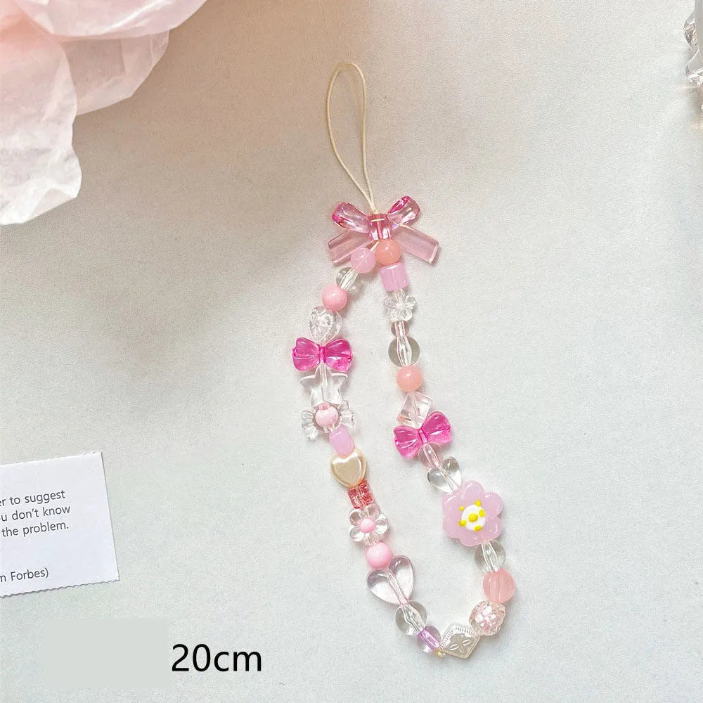 Beaded flower mobile phone lanyard with plastic resin decorations in blue, pink or yellow colour options