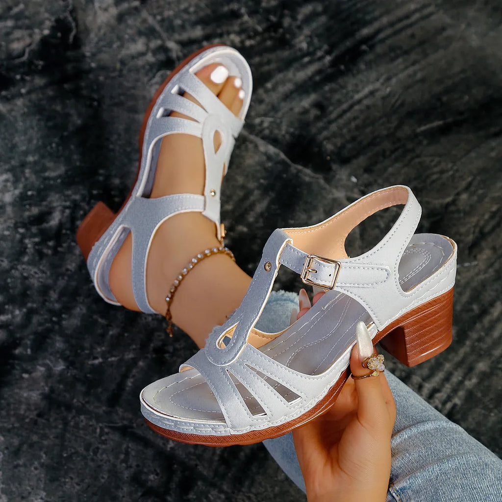 Women's black peep toe wedge platform sandals with a silver buckle closure on the instep.