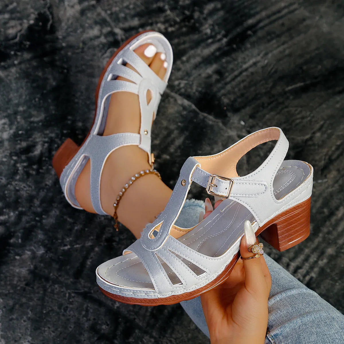 Women's black peep toe wedge platform sandals with a silver buckle closure on the instep.