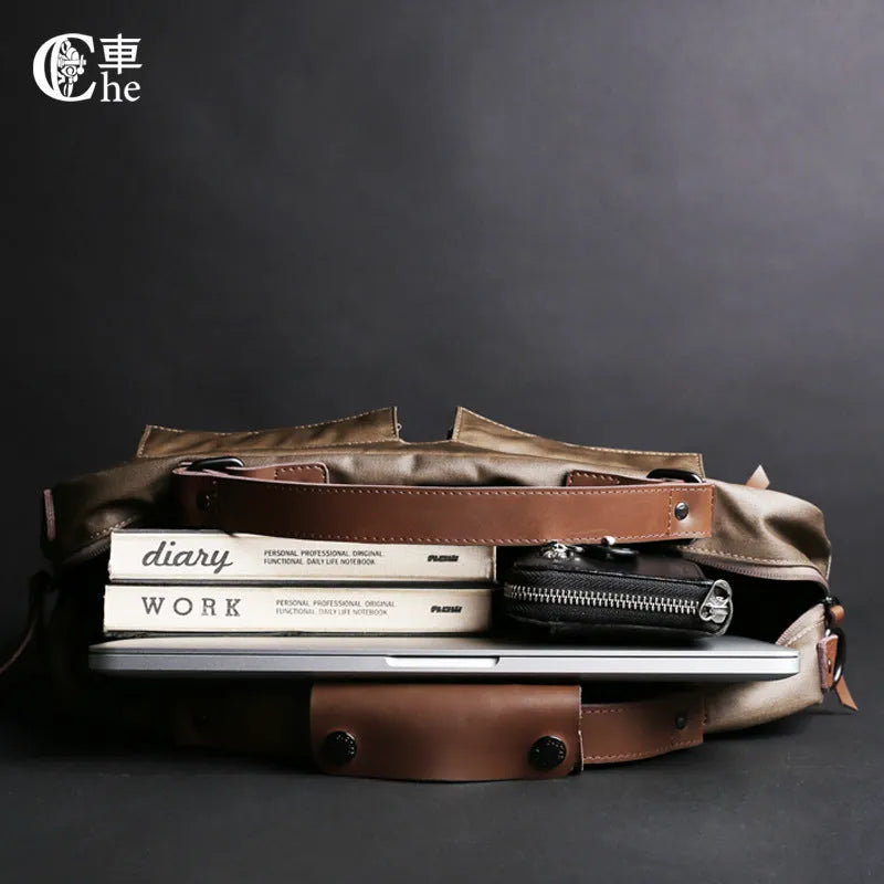 Dpark black men's shoulder bag for 14 or 15 inch laptops on a table