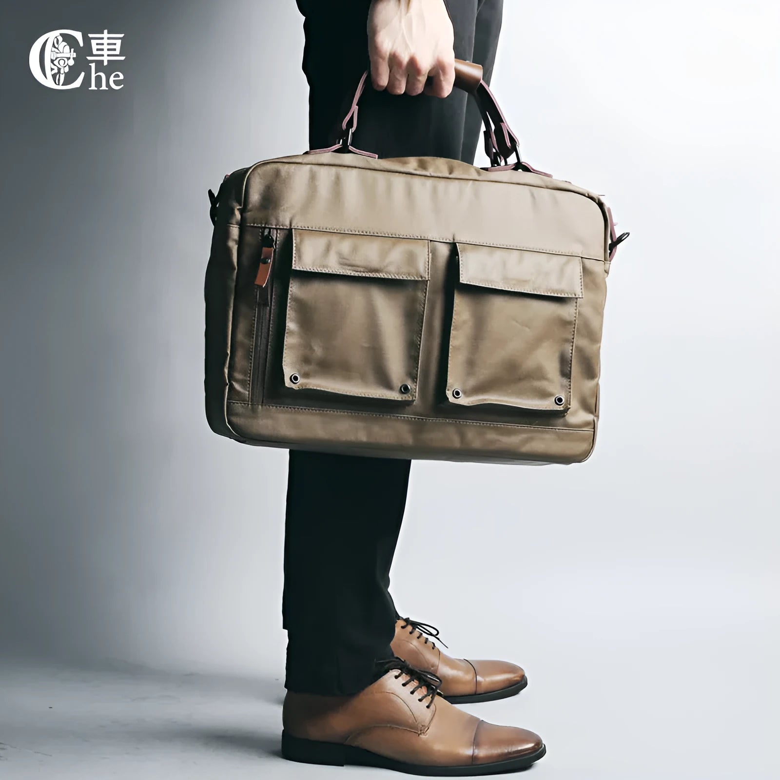 Dpark black men's shoulder bag for 14 or 15 inch laptops on a table