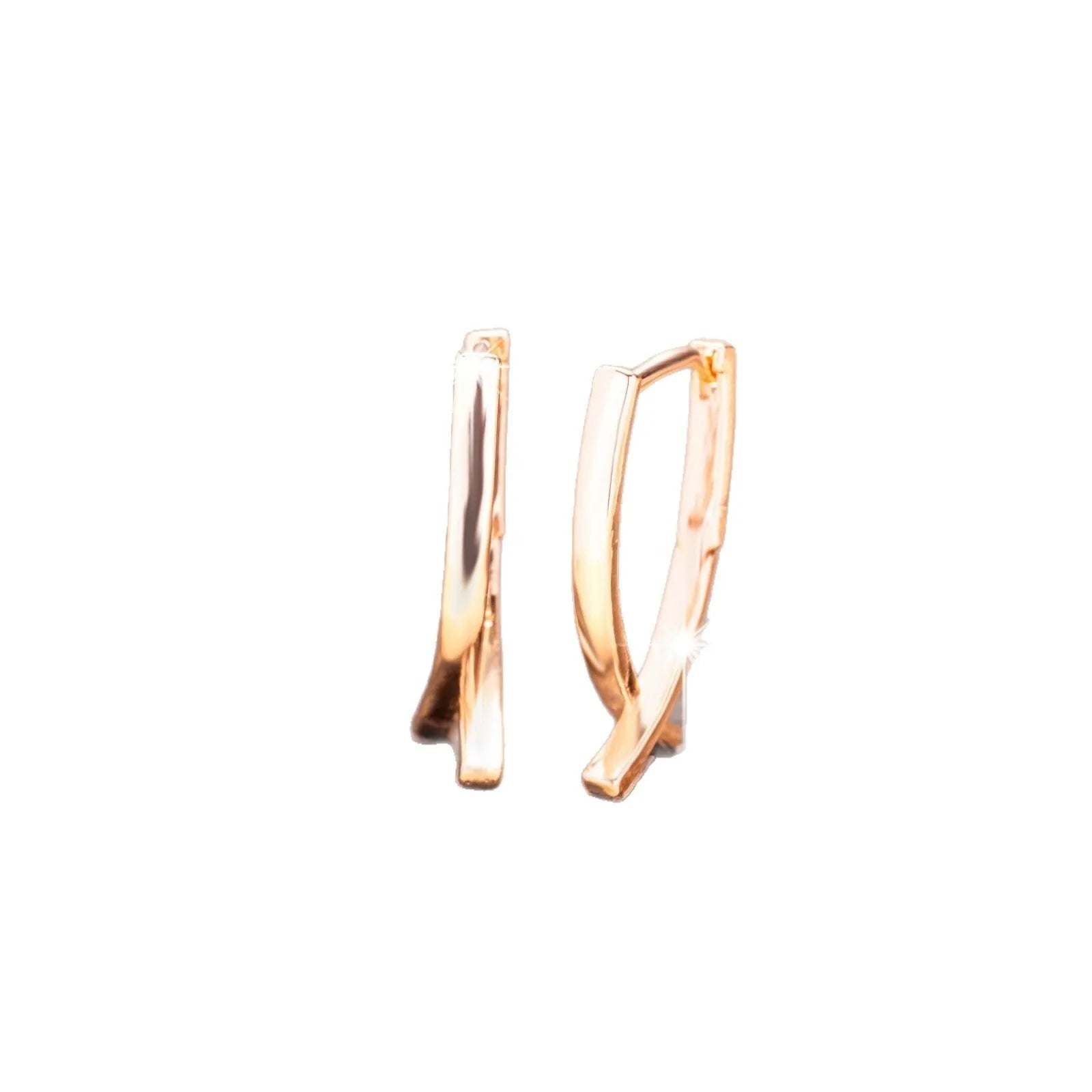 Rose gold coloured cross shaped drop earrings with contemporary light luxury styling