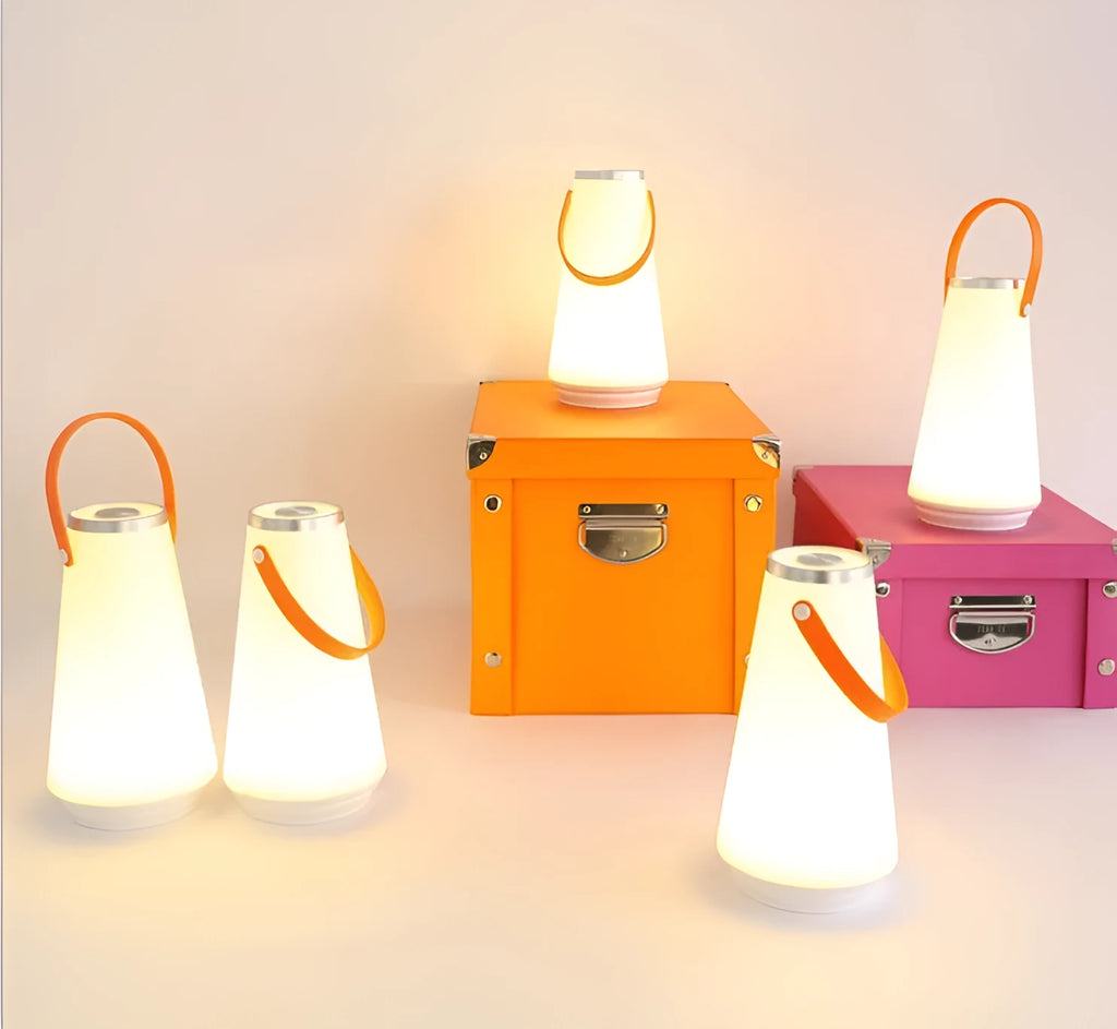 White rechargeable LED table lamp with adjustable brightness settings measuring 12x12x22cm
