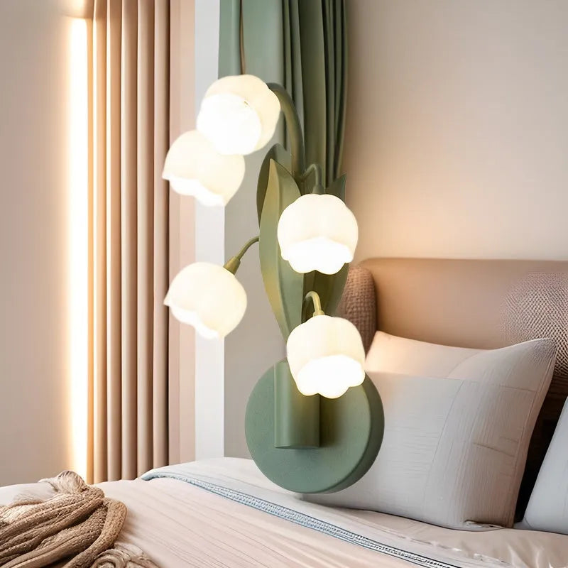 Green-tricolour French pastoral style wall lamp with a white minimalist PC shade mounted on a bedroom wall.