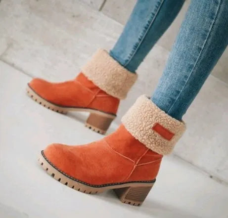 Women's mid-calf suede snow boots with a low heel and round toe in multiple colour options.