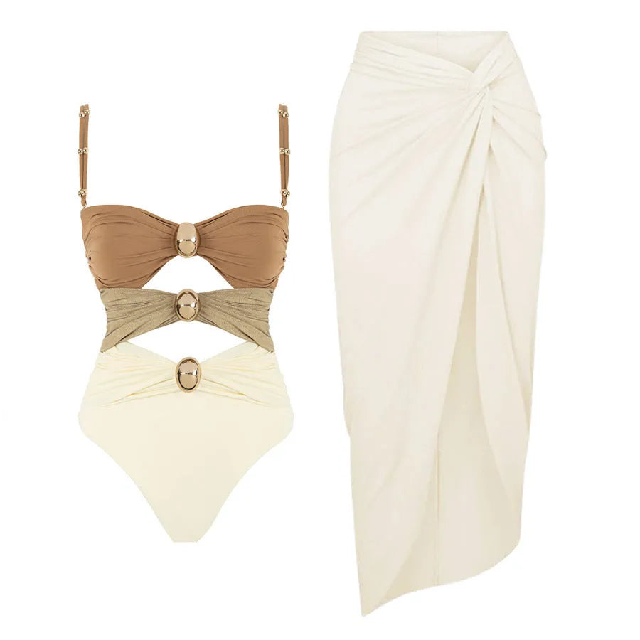 Women's one-piece swimsuit with matching skirt and gold button details in assorted colours