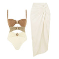 Women's one-piece swimsuit with matching skirt and gold button details in assorted colours