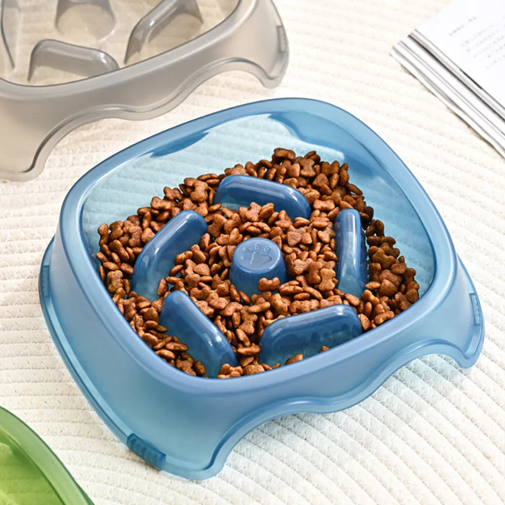 Blue plastic slow feeder dog bowl with raised obstacles for anti-choking design