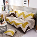 Printed geometric stretch sofa slipcover fitted on a three-seater sofa