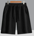 Cotton straight leg sports shorts in light grey colour showing micro-elastic fabric and fifth pants length