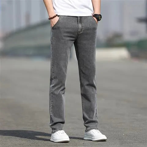 Man wearing smoky gray low-waist straight-leg jeans made from high-elasticity rabbit fur fabric.