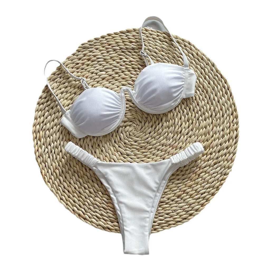 Women's black underwire bikini swimsuit set on a hanger.