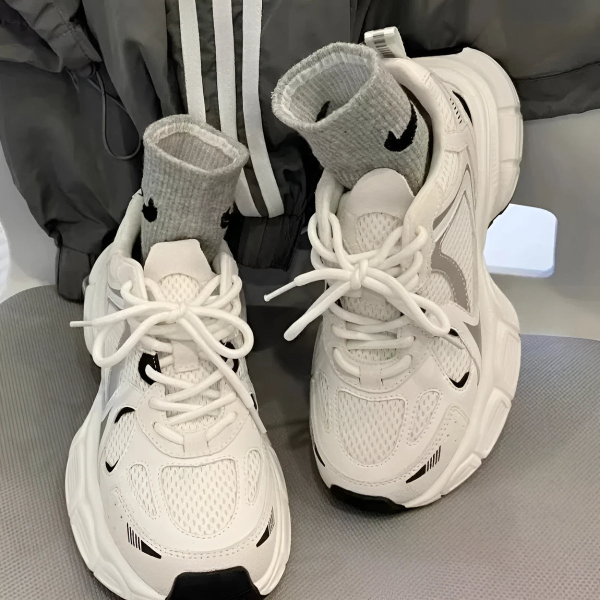 Beige mesh sports shoes with wedge heel and lace-up front on rubber sole