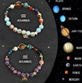 Two natural stone beaded bracelets on a stretch cord featuring zodiac sign charms.