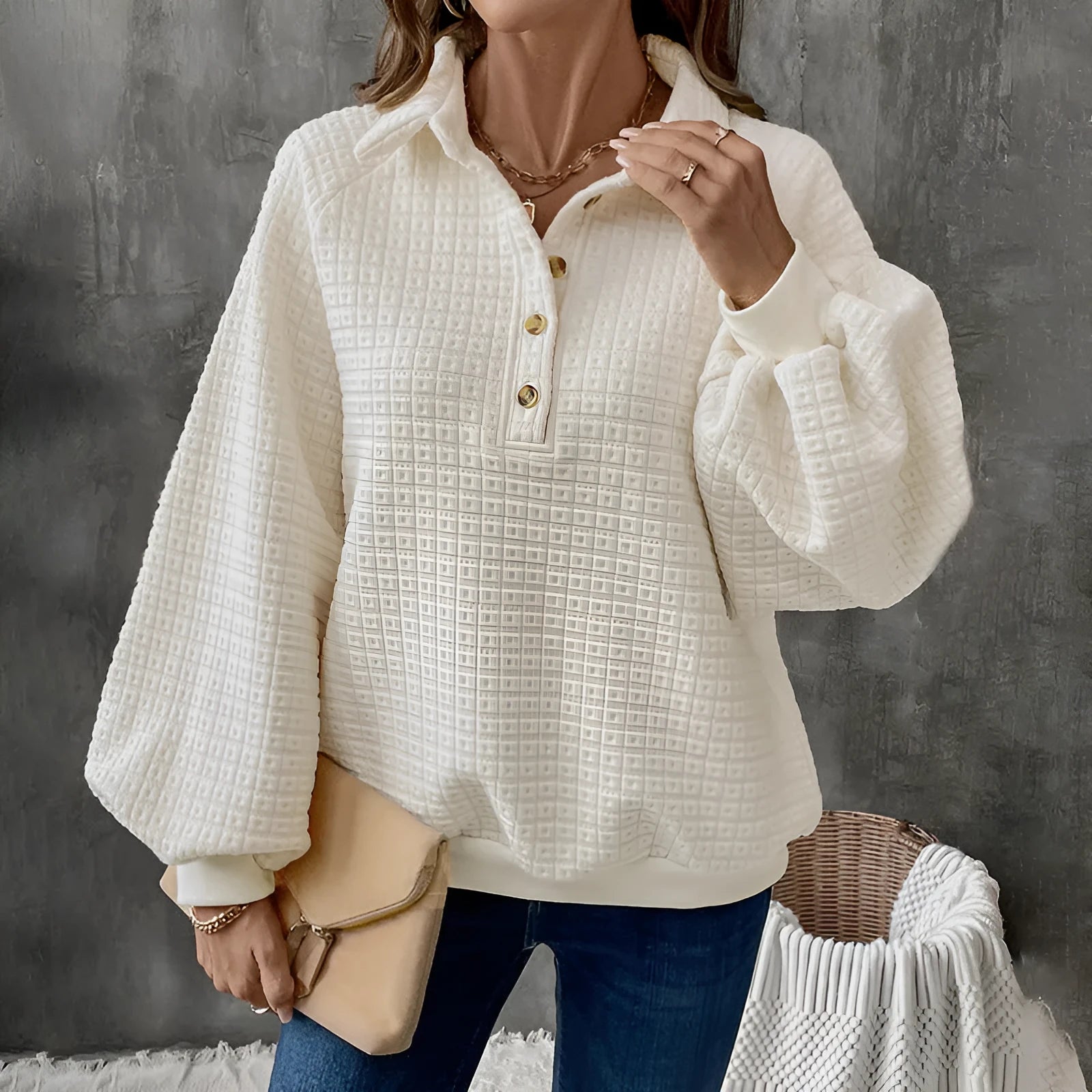 Women's milky white textured polo collar thick knit sweater on a hanger