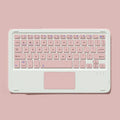 Pink wireless Bluetooth keyboard and silent rechargeable mouse set on a desk.